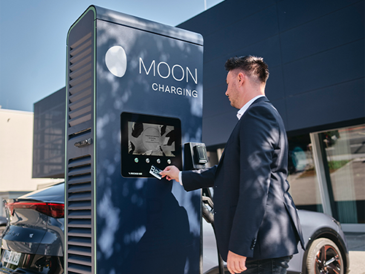 Card is held up to a display of a charging station
