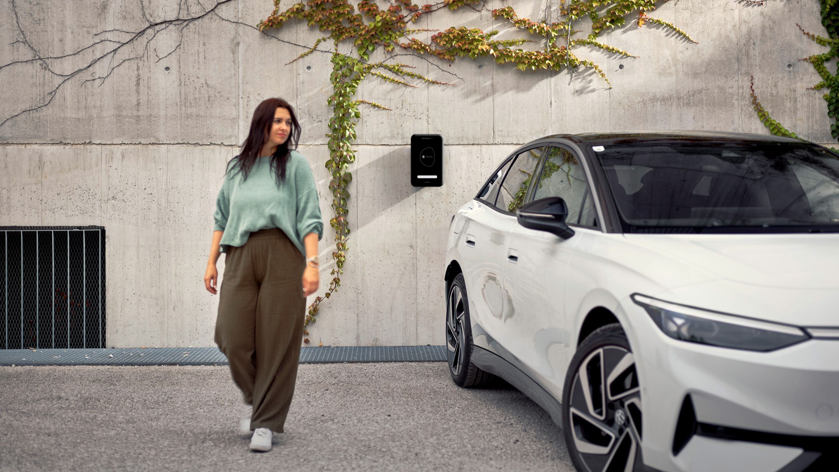 MOON POWER BiDi Charger on the wall behind a car