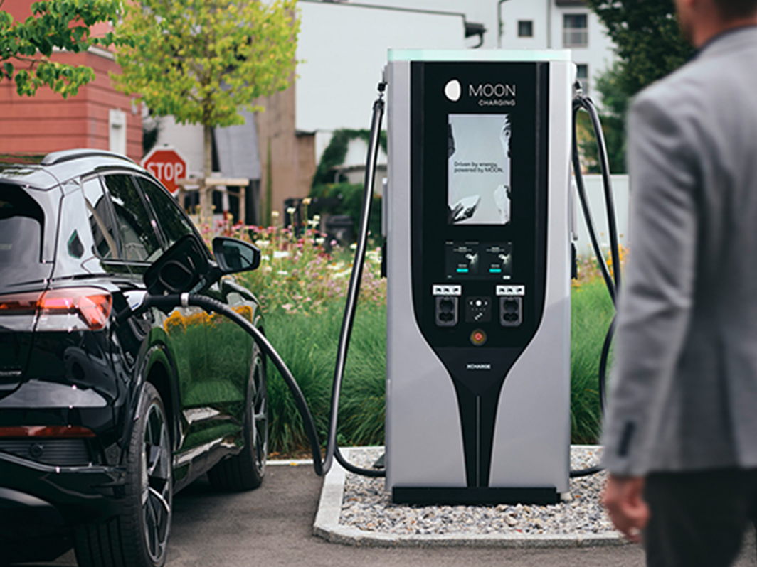 Person walks towards charging station