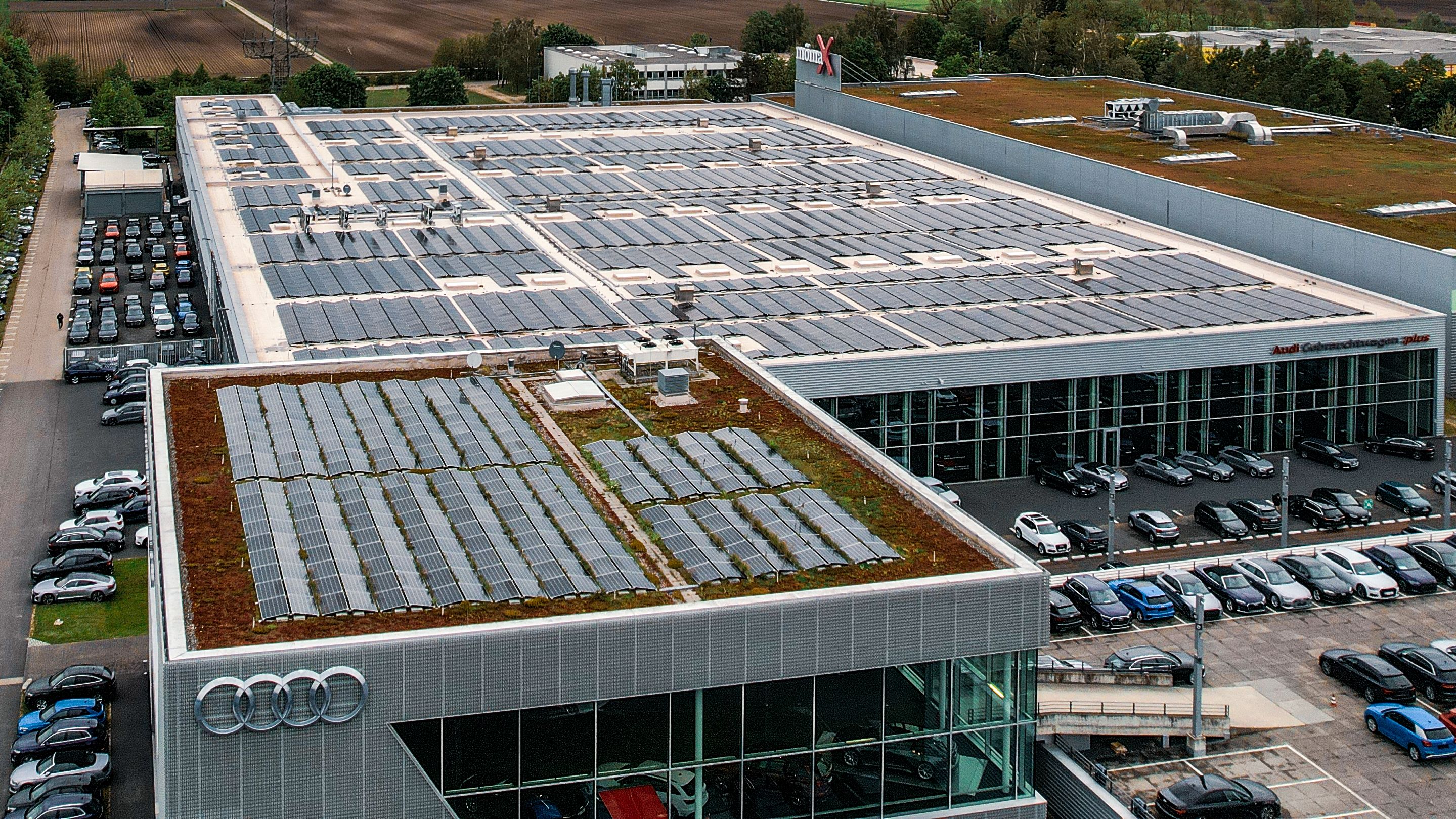 PV system on a roof next to a parking lot