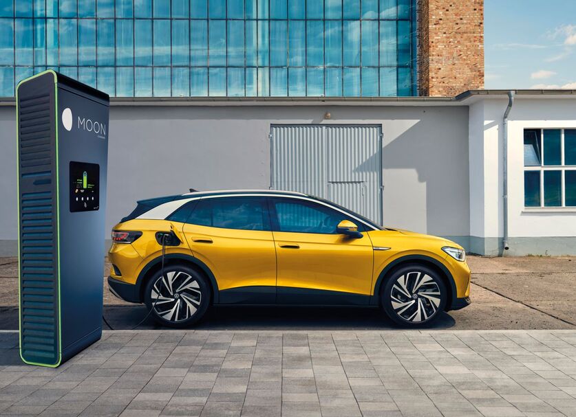 yellow VW ID.4 is charging at MOON's POWER Charger fast charging station