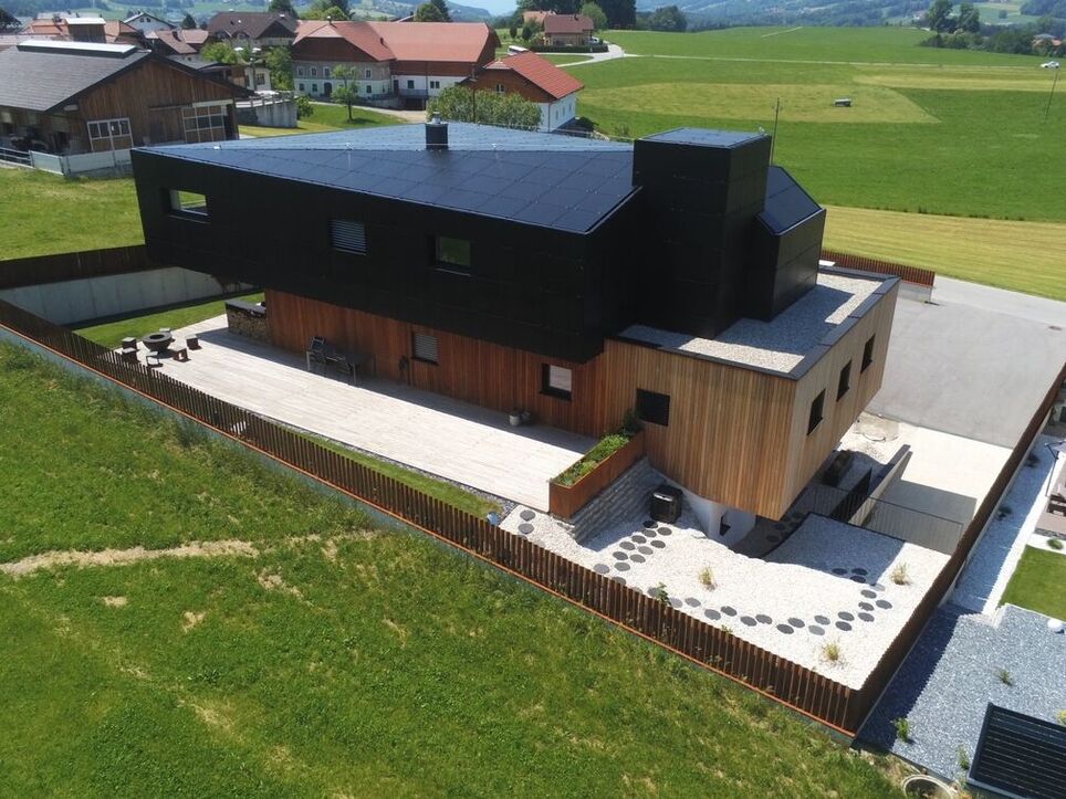 Flight view of the private house facade made out of dummy solar panels